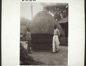 Container for rice wrapped round and roofed with straw (Boys' boarding school, Udapi)