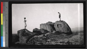 People on rocks near Qingdao harbor, China, ca.1920-1930