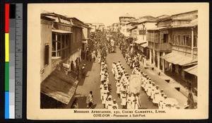 Religious procession down a city street, Ghana, ca.1920-1940
