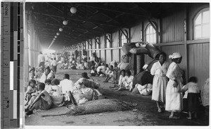 Refugees on railroad station platform, Shingishu, Korea, August 1935