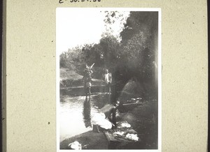 A Hausa-man washing his clothes in the river