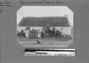 People in front of a house, Elim, South Africa