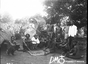 African sorcerer casting bones for divination, Antioka, Mozambique, ca. 1896-1911