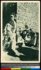 Three men of various ages spinning by a wall, Egypt, ca.1900-1930