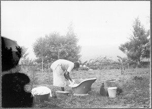 Washer at work, Mamba?, Tanzania, ca.1901-1910