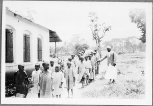 Teacher Ndelizo with students, Arusha, Tanzania, 1929