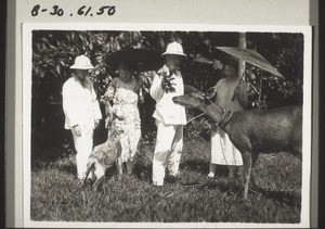 "Rev. Zimmer, his sister and the Brauns feeding a deer