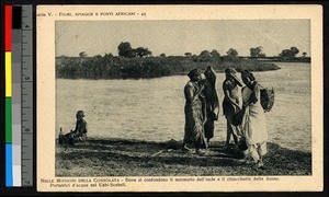 Women bearing baskets by a riverbank, Somalia, ca.1920-1940