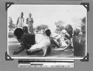 Schoolchildren during a writing lesson outdoors, near Mbozi, Tanzania, 1928