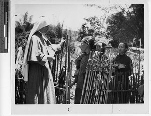 Maryknoll Sister house visiting at Meixien, China