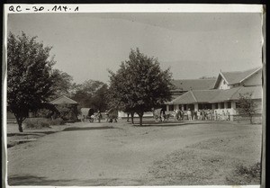 Eastern entrance to the mission hospital in Betgeri. Old hospital building with porch. New hospital with porch