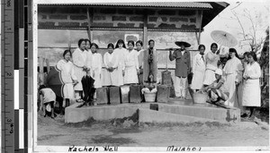 Two Maryknoll Sisters standing with a group of people at Rachel's Well, Malabon, Philippines, March 1929