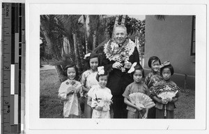 Bishop Leech and Maryknoll schoolchildren dressed for the fan dance, Honolulu, Hawaii, September 26, 1939
