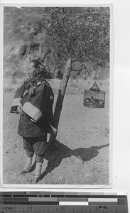 A woman with bound feet at Fushun, China