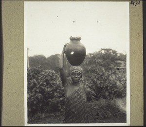 A water-carrier in Kota Barombi