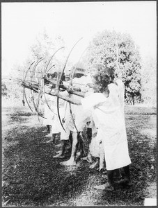 Boys shooting with bows and arrows, Gonja, Tanzania, ca. 1927-1938