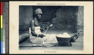 Woman spinning cotton at Ouagadougou Mission, Burkina Faso, ca.1920-1940