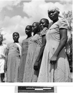 Five women standing in a row, Africa, October 1950