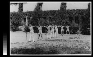 Archery class with the traditional Chinese bow and arrows, Yenching University, Beijing, China, 1941