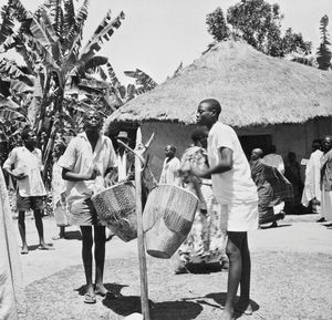 Outside a church in Tanganyika/Tanzania using African drums at the worship service