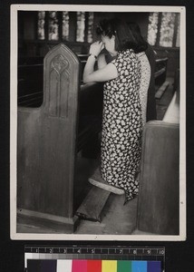 Two Christians praying in church, China, ca. 1947