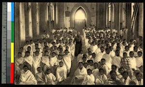 Congregants and clergy inside country church, Madagascar, ca.1920-1940