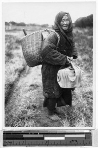 Elderly woman on a dirt road, Japan, August 1932