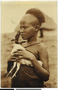 Ethiopian or Somali girl with a chicken, Ethiopia