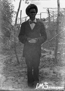 African man carrying books