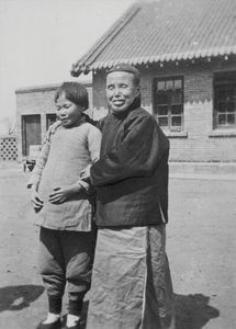 Blind home Blind School in Mukden. Mrs. Szu with a little blind girl