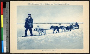 Missionary father leading sled team across a snowfield, Canada, ca.1920-1940