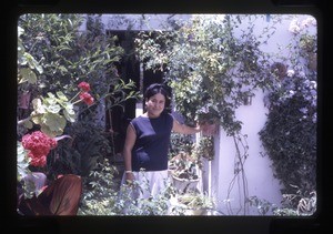 woman standing outside her home