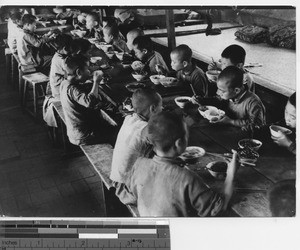 Orphan boys at meal time at Fushun, China, 1939