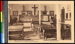 View of a classroom with a large crucifix on the wall, Congo, ca.1920-1940