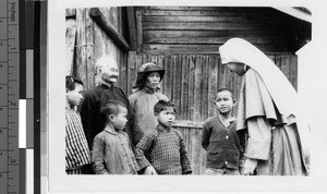 Maryknoll Sister talks with family, Kaying, China, ca. 1940