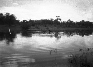 African people crossing a flooded road, Mahele, Mozambique