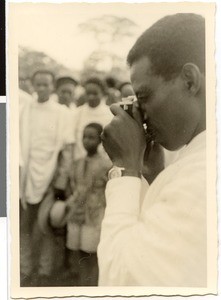 Pastor Dafaa taking a photograph, Ayra, Ethiopia, 1952