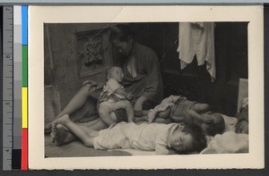 Impoverished family sleeping outdoors, Shanghai, China, ca.1938