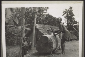 A schoolboy drumming everybody to school