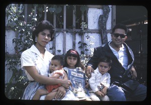 Family outside their home