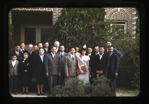 Group outside red brick building