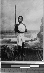 Boy posing with a spear and shield, Africa, ca. 1920-1950