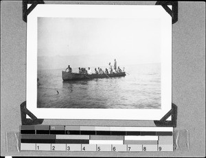 Men sitting in a boat, Lake Malawi, Malawi, 1936