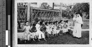 Orphans playing game with Maryknoll Sister, Loting, China, ca. 1930