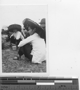 Young women wearing "lampshade" hats at Stanley, Hong Kong, China, 1939