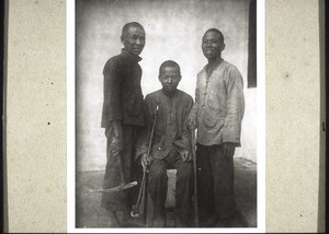 Master carpenter with his two apprentices, right and left