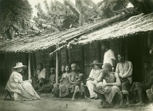People in front of a house, in Gabon