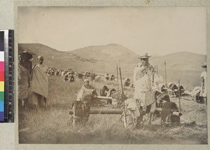 Men resting with loads at Ambatovory Hill, Madagascar, ca. 1890