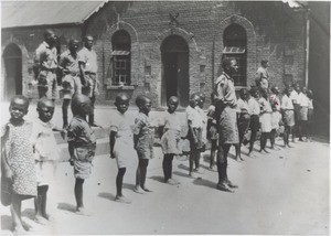 Pupils and boy scouts in front of the Morija Normal School