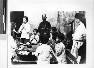 Maryknoll Sister praying with orphans, Yeung Kong, China, ca. 1939